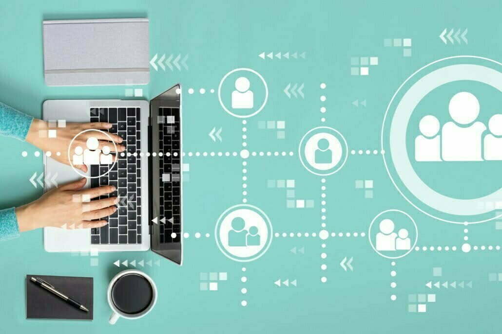 Social connections theme with person using a laptop